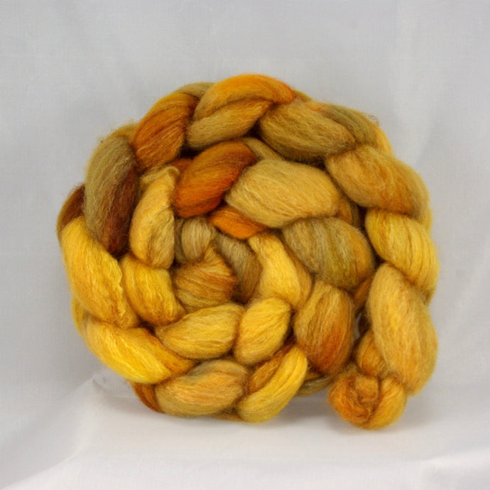 hand-dyed bfl/silk dyed in golden, warm tones of yellow and orange